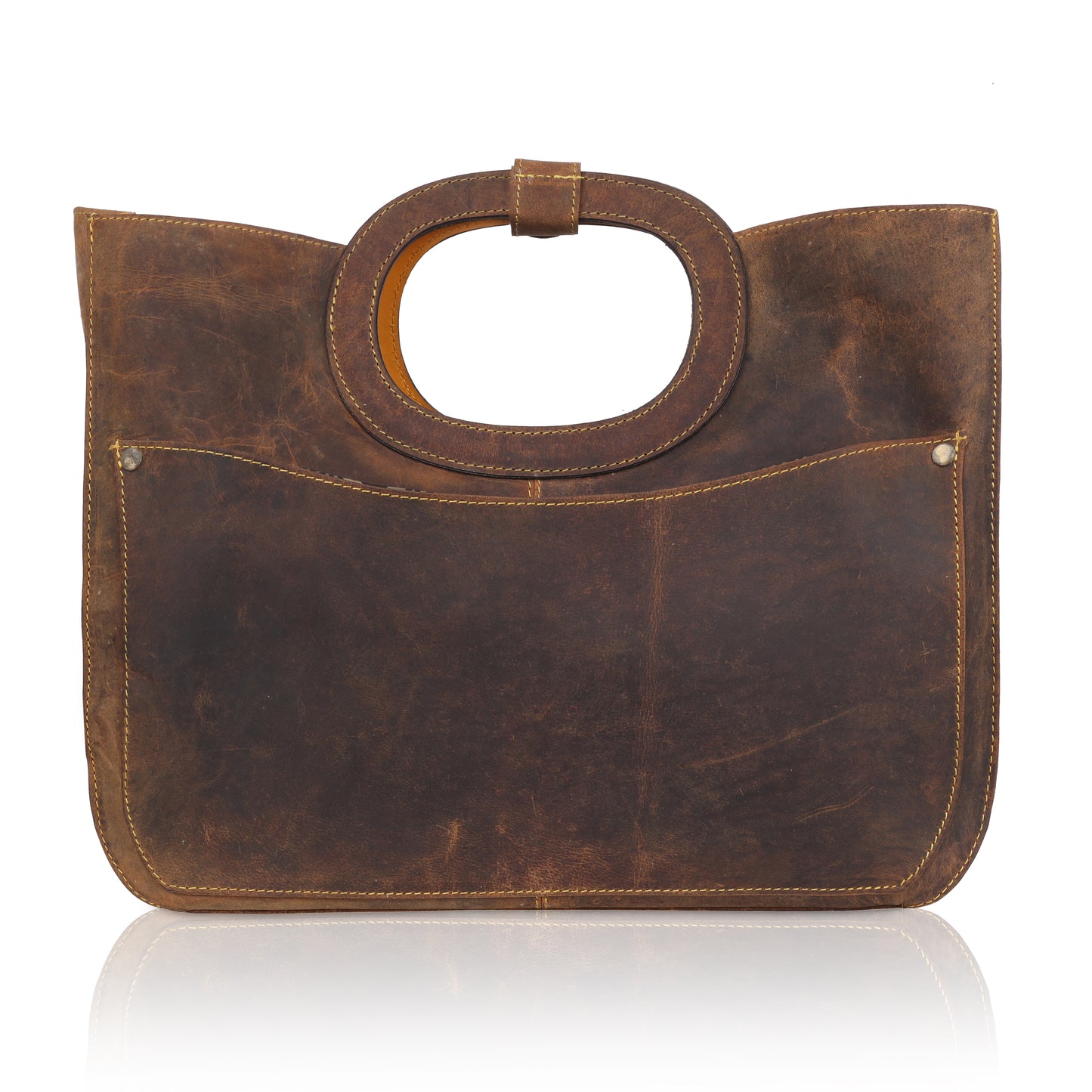 This unique tote bag features an intricate laser-cut floral pattern on rich brown leather, with a golden inner lining that shines through the cutwork for a striking effect
