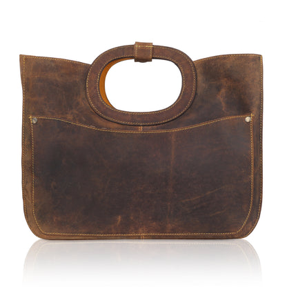 This unique tote bag features an intricate laser-cut floral pattern on rich brown leather, with a golden inner lining that shines through the cutwork for a striking effect